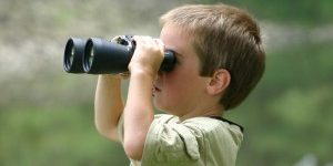 Child-with-binoculars-300×200